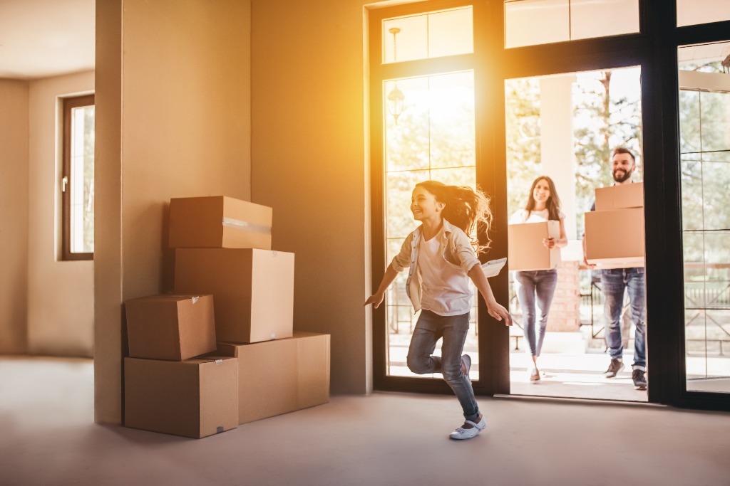 Happy family moving into their new home